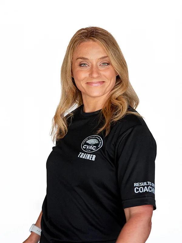 Diana Diana, Personal Trainer, smiles on a white background