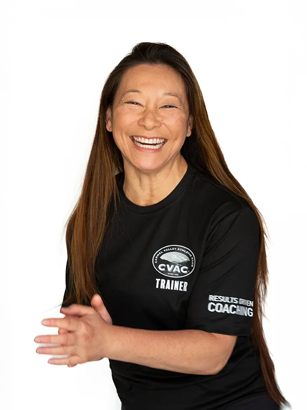 Kimi 2 Kimi, Personal Trainer, smiles on a white background