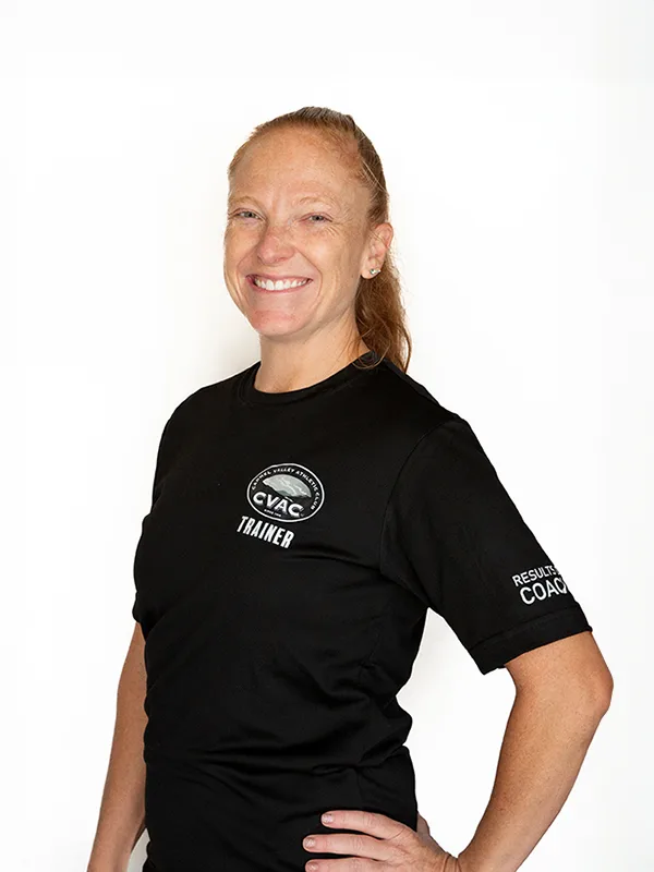Megan 2 Megan, Personal Trainer, smiles on a white background