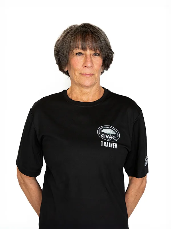 Terri Terri, Personal Trainer, smiles on a white background